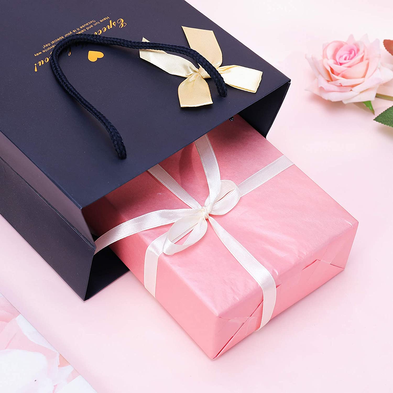 Sacchetto di carta in cartone stampato con logo blu personalizzato di lusso con manico a fiocco in nastro per scatole della spesa per regali
